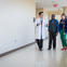 Doctor walking with patients.