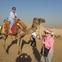 Mona Dewart on a camel