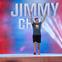 Jimmy Choi with his hands in the air cheering, while walking on to the American Ninja Warrior course.