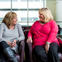 Two friends sitting in a doctor's office.