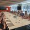 MJFF's summer Interns sitting around the table in a conference room.