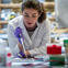 Female researcher pipetting in the lab.