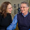 Female and male couple smiling in the doctor's office.
