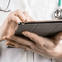 Doctor with tablet.