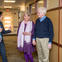 Three people talking at a clinic