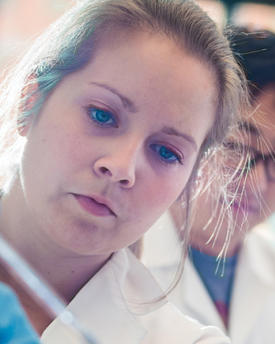 Scientist looking at a slide in a laboratory