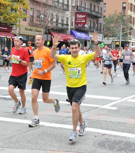 Three Caucasian males running a marathon.